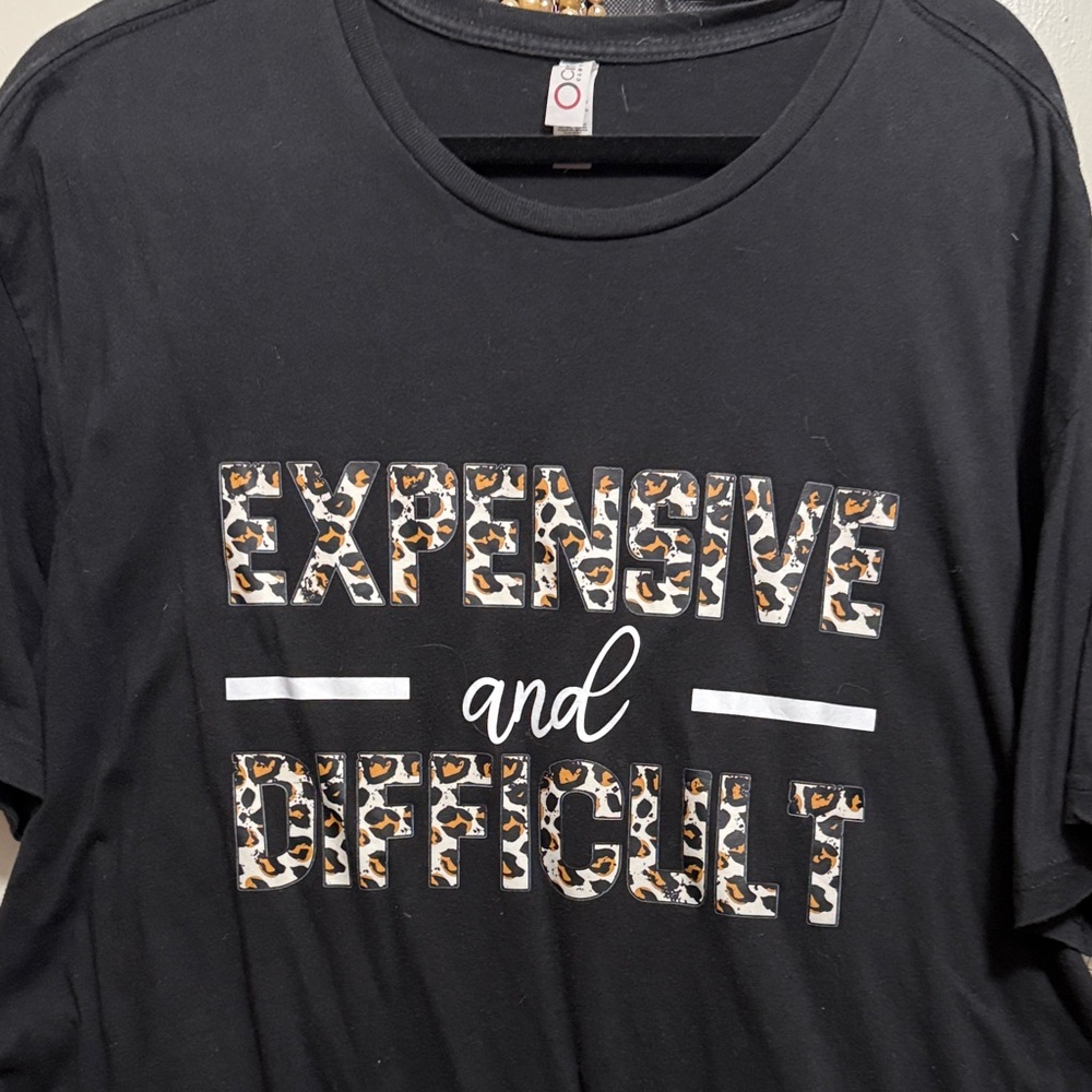 Black Graphic T-Shirt with Leopard Print Text